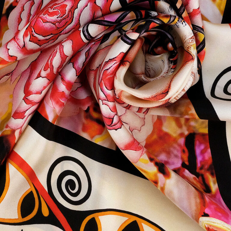 The closeup view of The Beginning pure silk scarf of soft pink hue underlined with bold strikes of rich brown and Trypillian symbols.