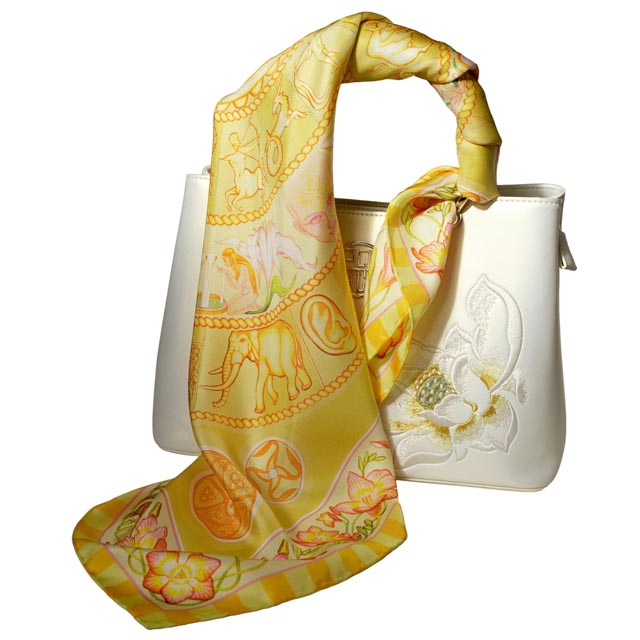 Bring a shiny sun-spot to your look with the Golden Sky amber gold silk scarf by PSICHORA.