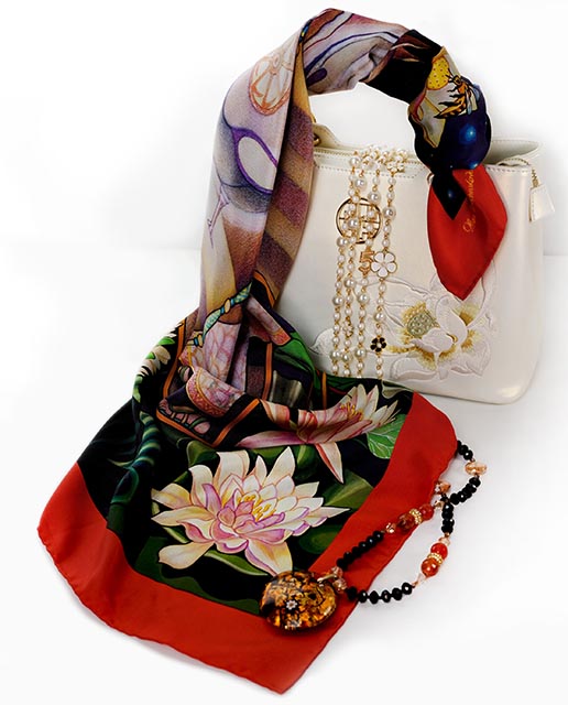 Stay stylish yet noticed with the Arrival pure silk scarf of rich reds, dark blues and florals full of lotus flowers by PSICHORA.