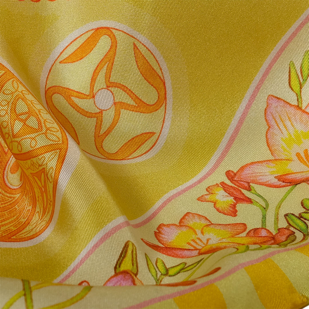 PSICHORA: feel the glowing luxury of the Golden Sky pure silk scarf close up view.