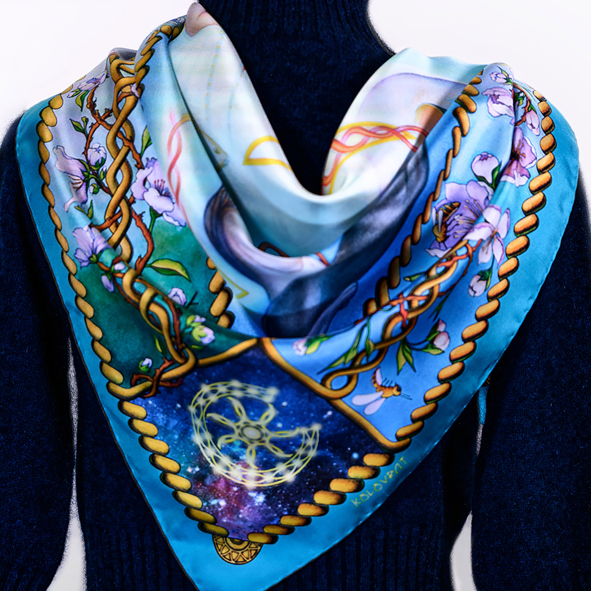 Step in style in the Creation N5 teal blue silk scarf 90 with Celtic knots entwined by white bloom and golden bees.