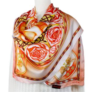 Wrap yourself in the soft elegance of this golden pink reversible pure silk scarf - a masterpiece of artistry and meaning. Designed in AU and made in China, this scarf keeps the colours and refined graphics striking on every silk turn.