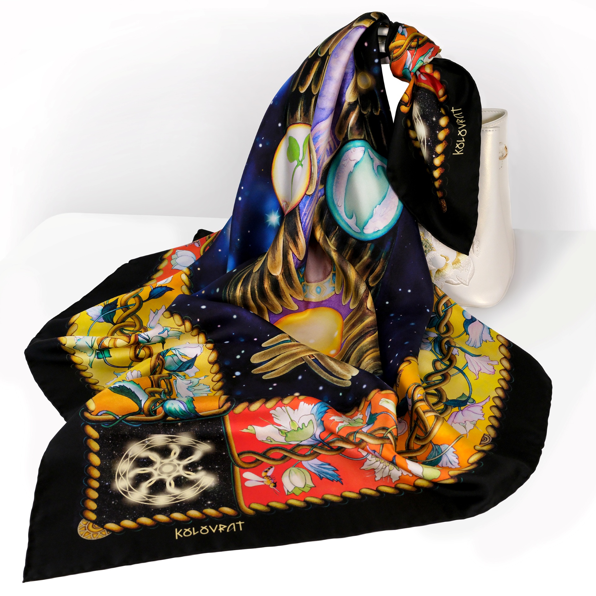 The Creation designer silk scarf blends black, red, amber, golden, and blue tones into a most enigmatic composition. Made in Italy, this PSICHORA piece carries an aura of cosmic splendour, adding a sense of deep space-inspired sophistication to your look.
