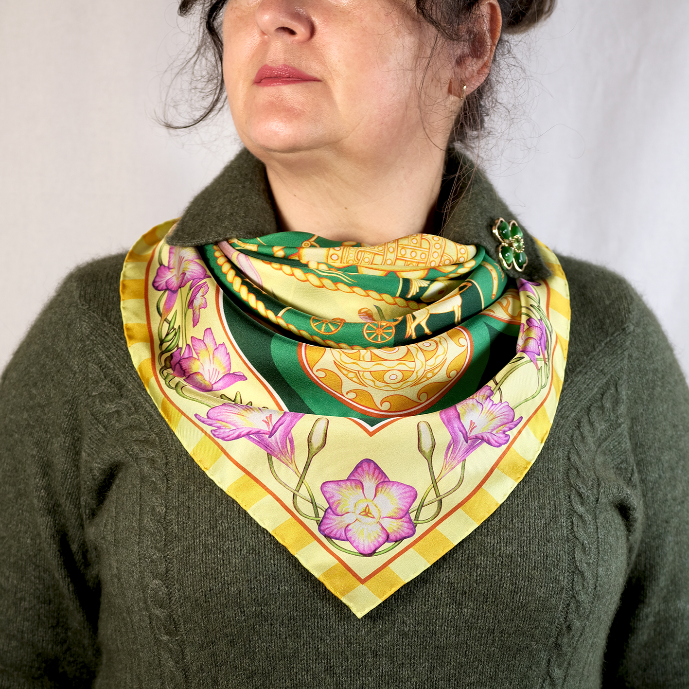 Step in style with the Emerald Sky designer silk scarf 90cm of golden celestial wheals of Zodiac & Nakshatras, pink florals and telling imagery in a luminous, cosmos‑inspired design. Designed in Australia and made in Italy, this PSICHORA piece brings a refined statement piece to your look.