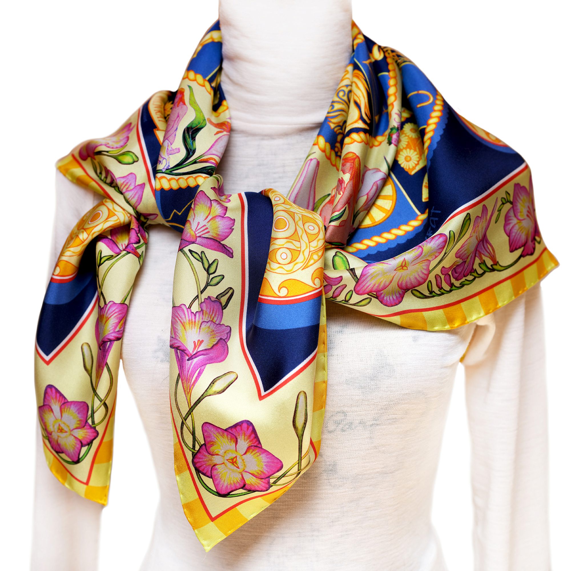 The Night Sky navy blue silk scarf 90cm pairs golden celestial wheals of Zodiac & Nakshatras, pink florals and telling imagery with the deep blues of night sky in a luminous, cosmos‑inspired design. Designed in Australia and made in Italy, this PSICHORA piece brings a refined statement piece to your look.