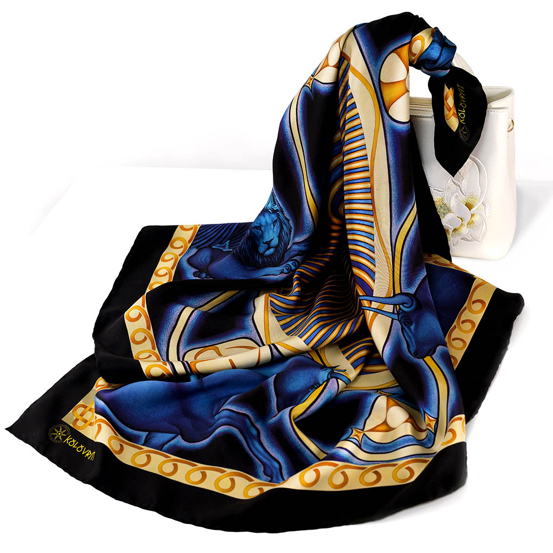 Designed in Australia and made in Italy the Cosmic Creation designer silk scarf blends dark navy and royal blue colours lit with golden symbols, and creates sense of cosmic depth and refined elegance. By PSICHORA.