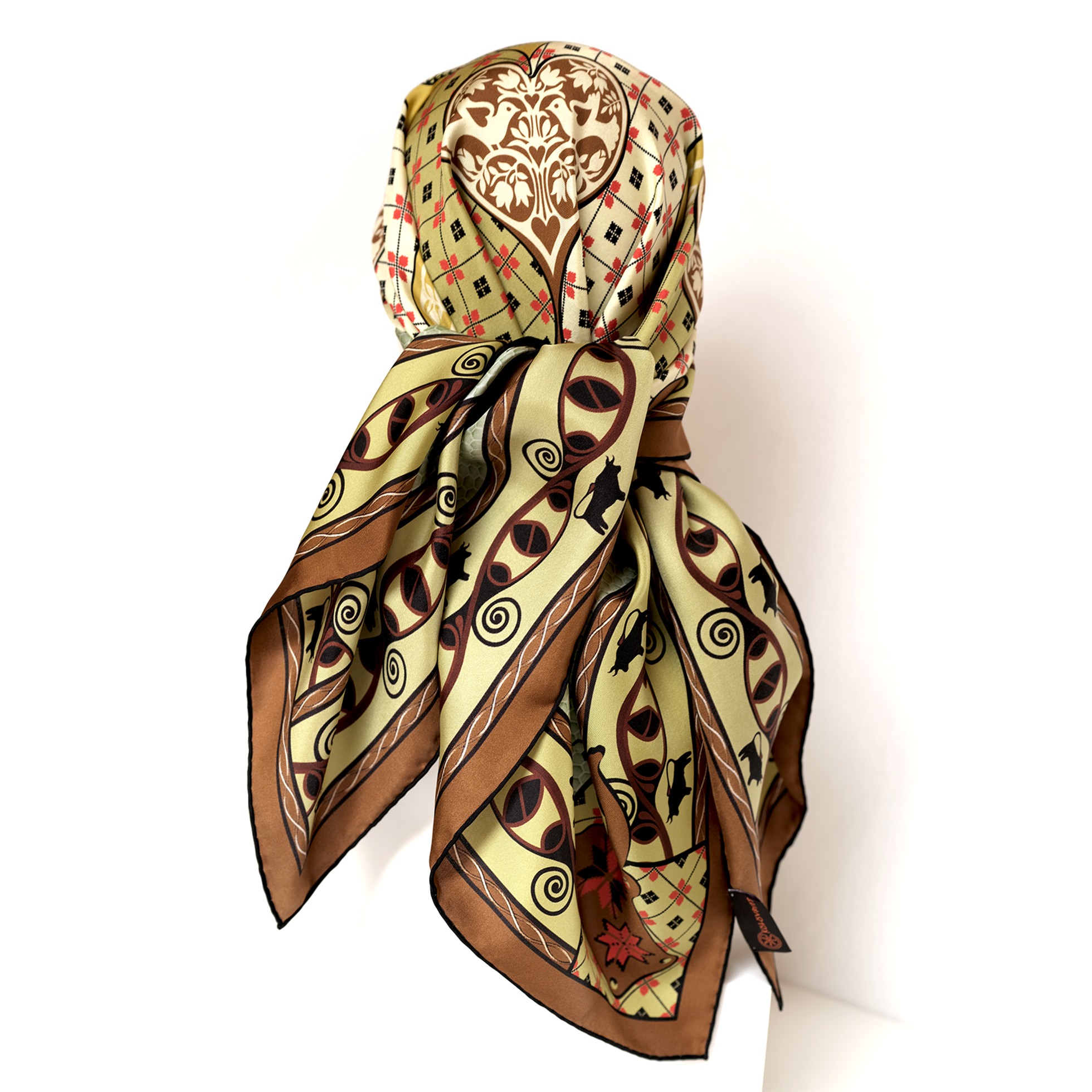 Envelop in the vibes of the Talisman terracotta olive silk scarf. Designed in Australia and handcrafted in Italy, this luxurious accessory fosters a sense of harmony infused with love and inner stability. Experience the protective power of Talisman, enhanced by the energy of the Trypillia DNA symbols.
